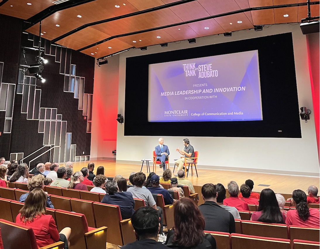 Photograph of a lecture hall with a presentation about TV and media