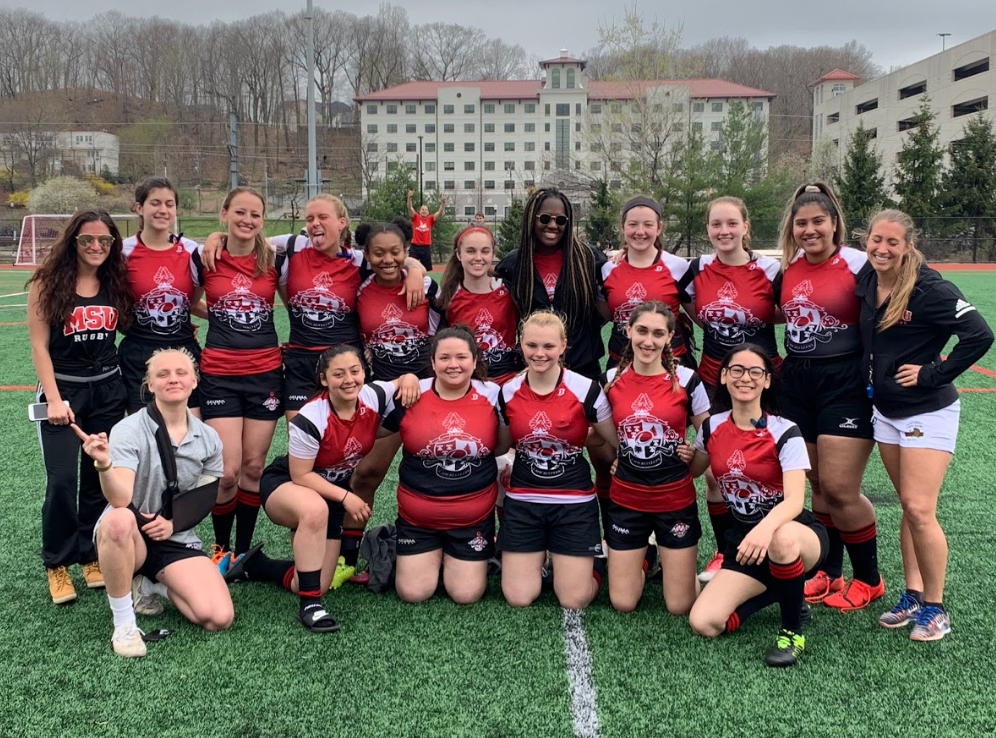 Montclair State University club women's rugby players posing for a team photo