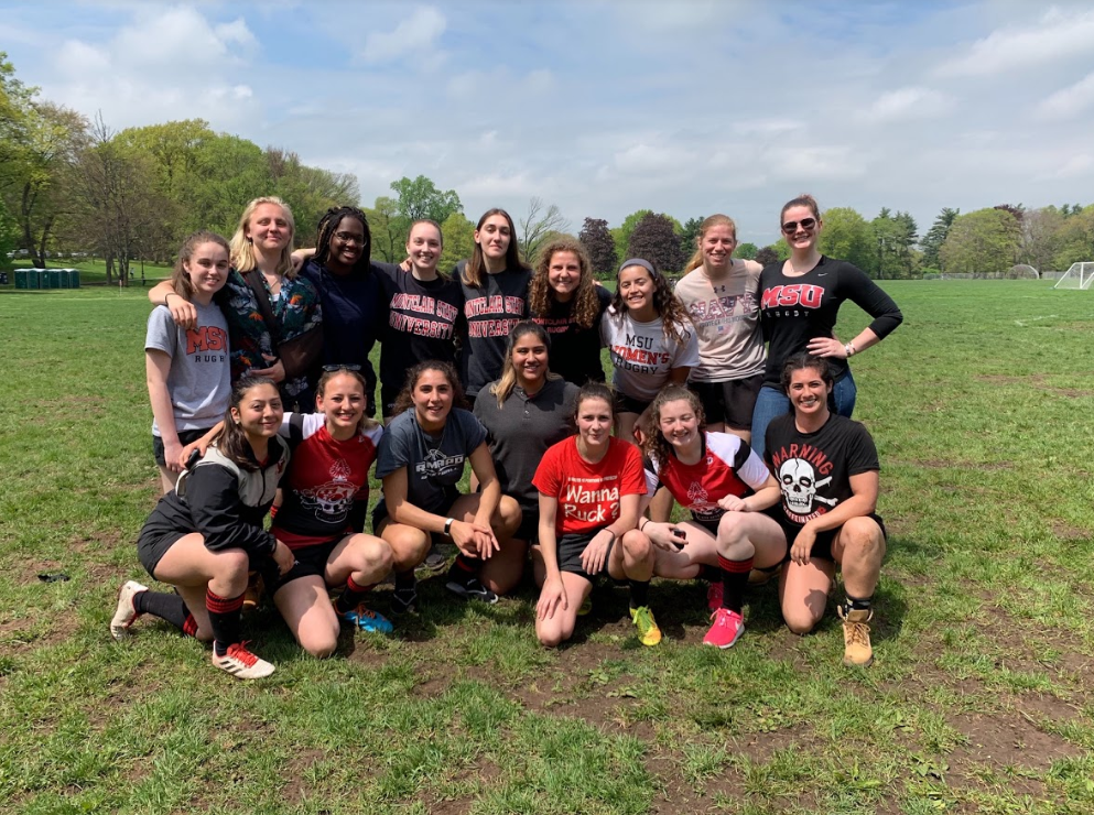 Montclair State University club women's rugby players posing for a group photo