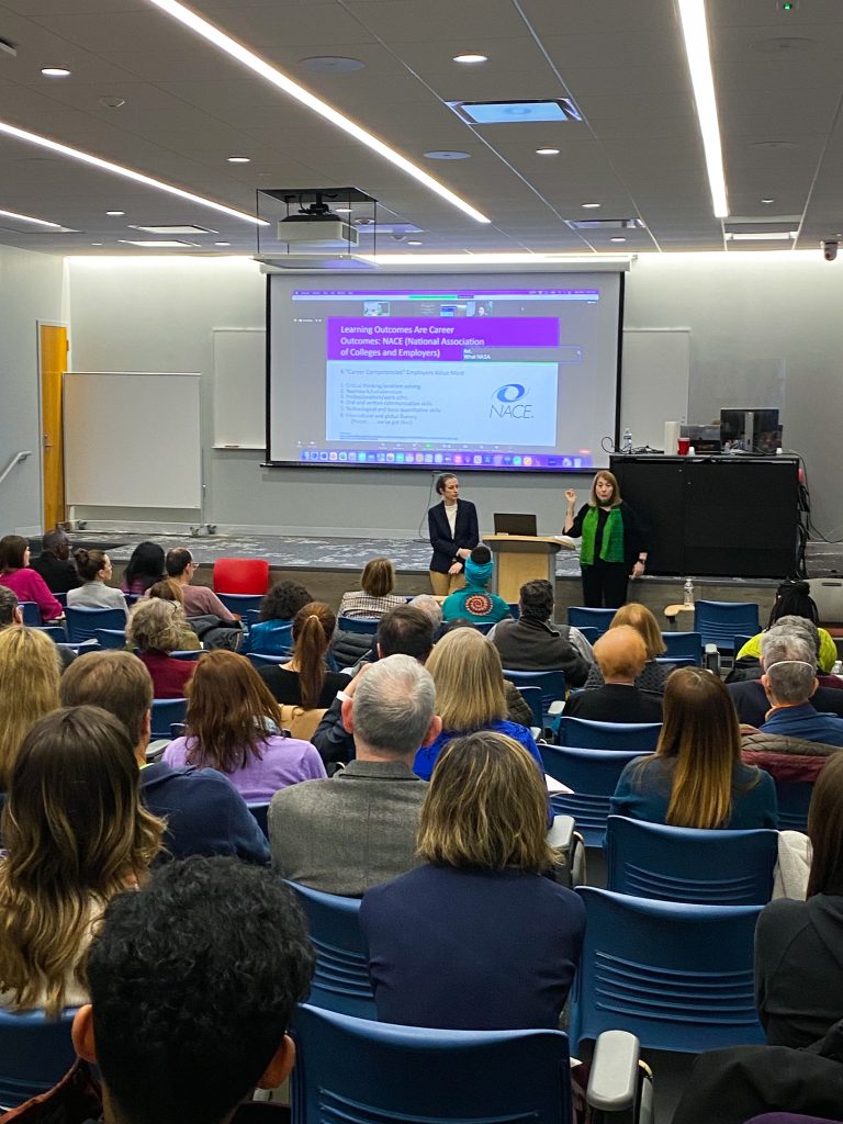 Back view of the classroom, with Drs.,Cathy N Davidson and Christina Katopodis presenting up front.