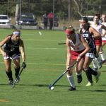 photo of women playing field hockey