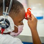 child facing to the side wearing headphones