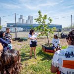 JV Valladolid, center, leads the tour for the Ironbound Community Corporation. The tour was an opportunity for the Montclair students to learn about the environmental challenges facing the Ironbound and the movement over five decades for environmental justice.