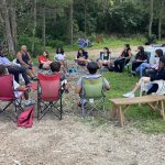 students sitting in circle outdoors