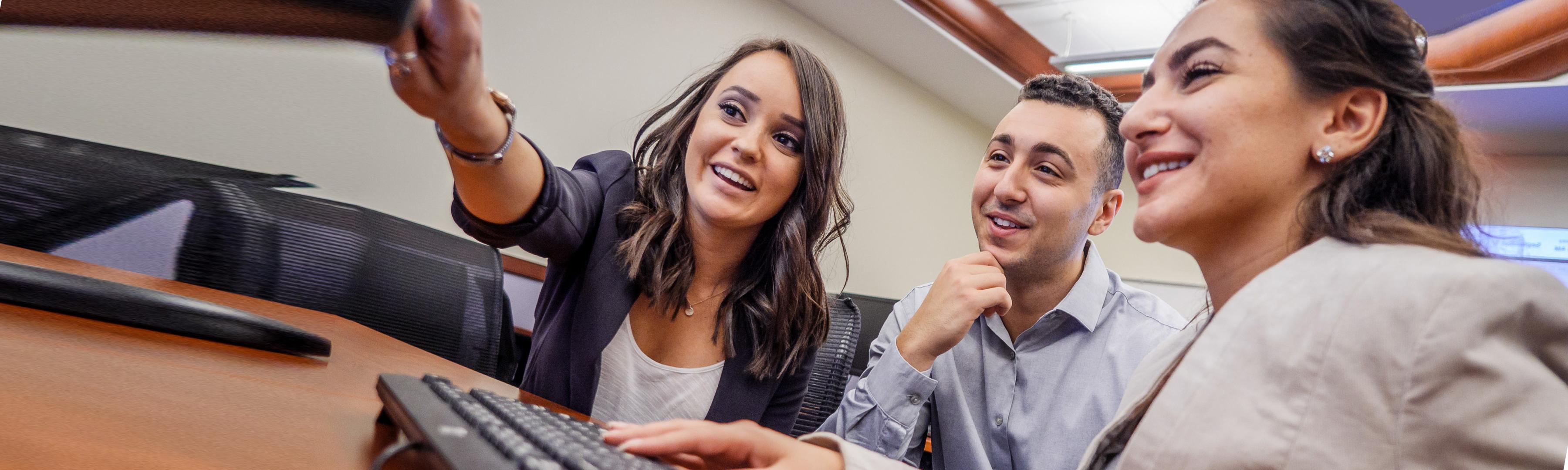 Photo of Students looking at computer