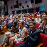 Theatre full of attendees.
