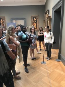 Small group of high school students visit the Metropolitan Museum of Art in NYC