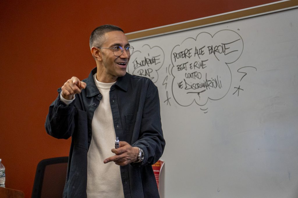 Amir Issaa in front of whiteboard