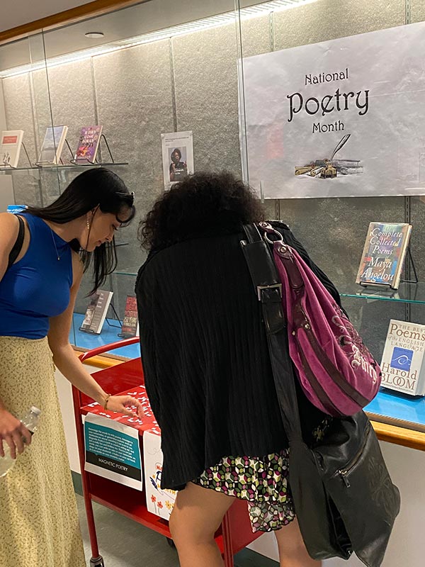 Students playing with poetry magnets