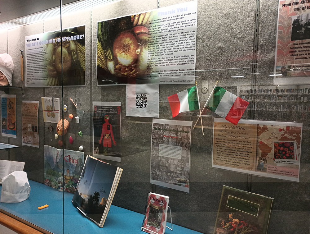 cookbook display with various cookbook related artifacts