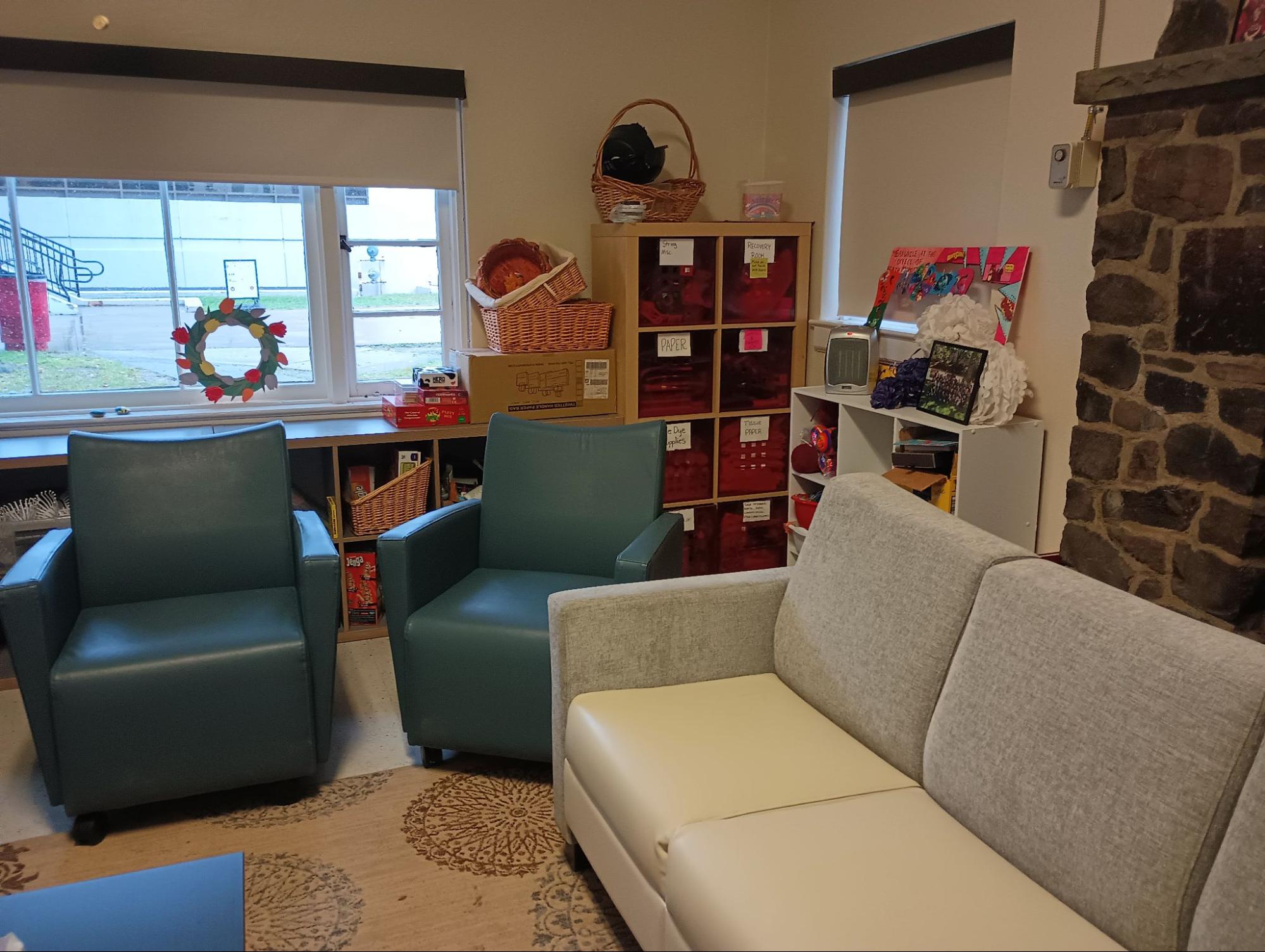 a couch and chairs in the drop-in center