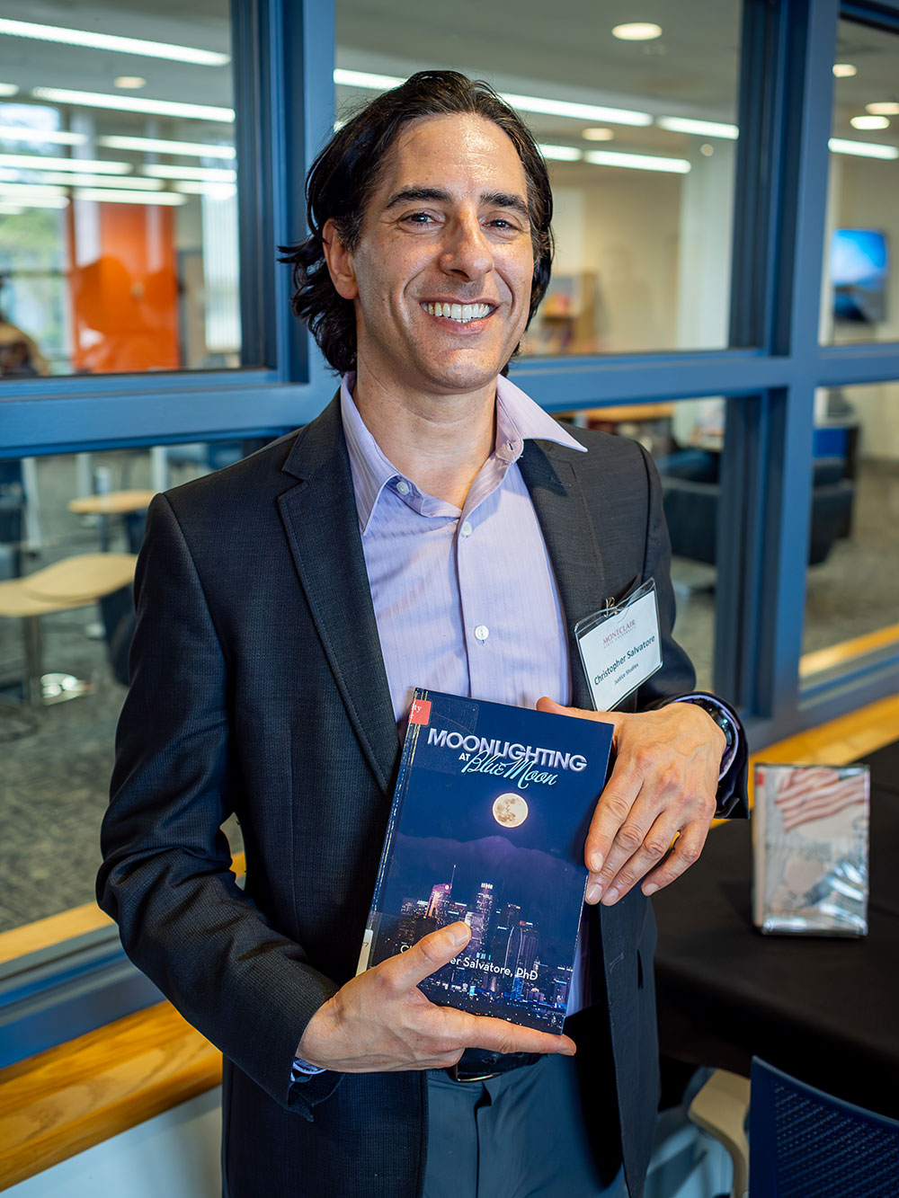 author holding book