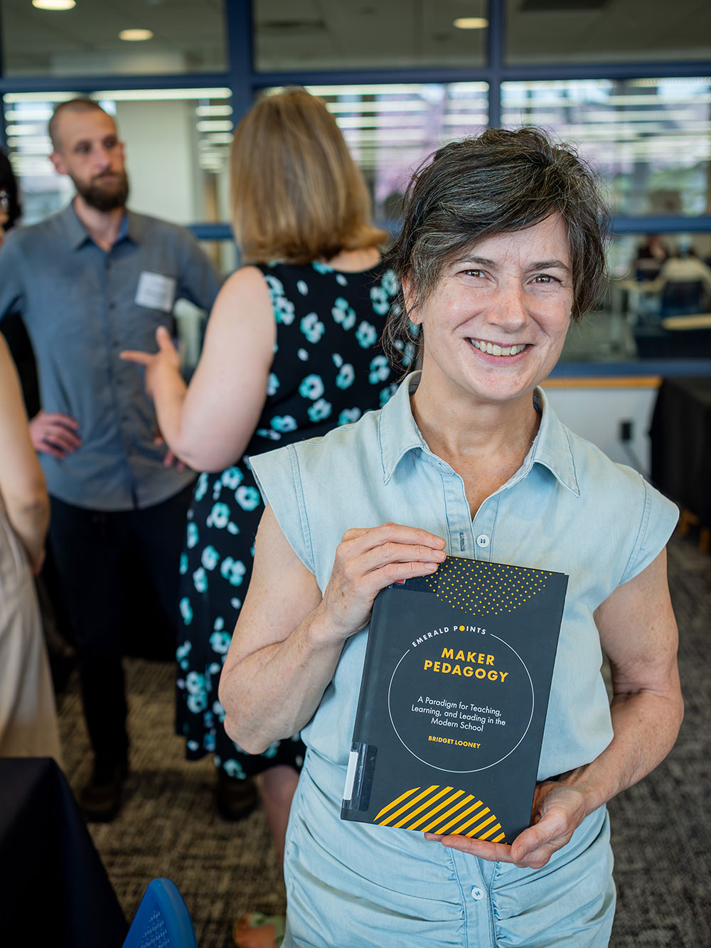 author holding book