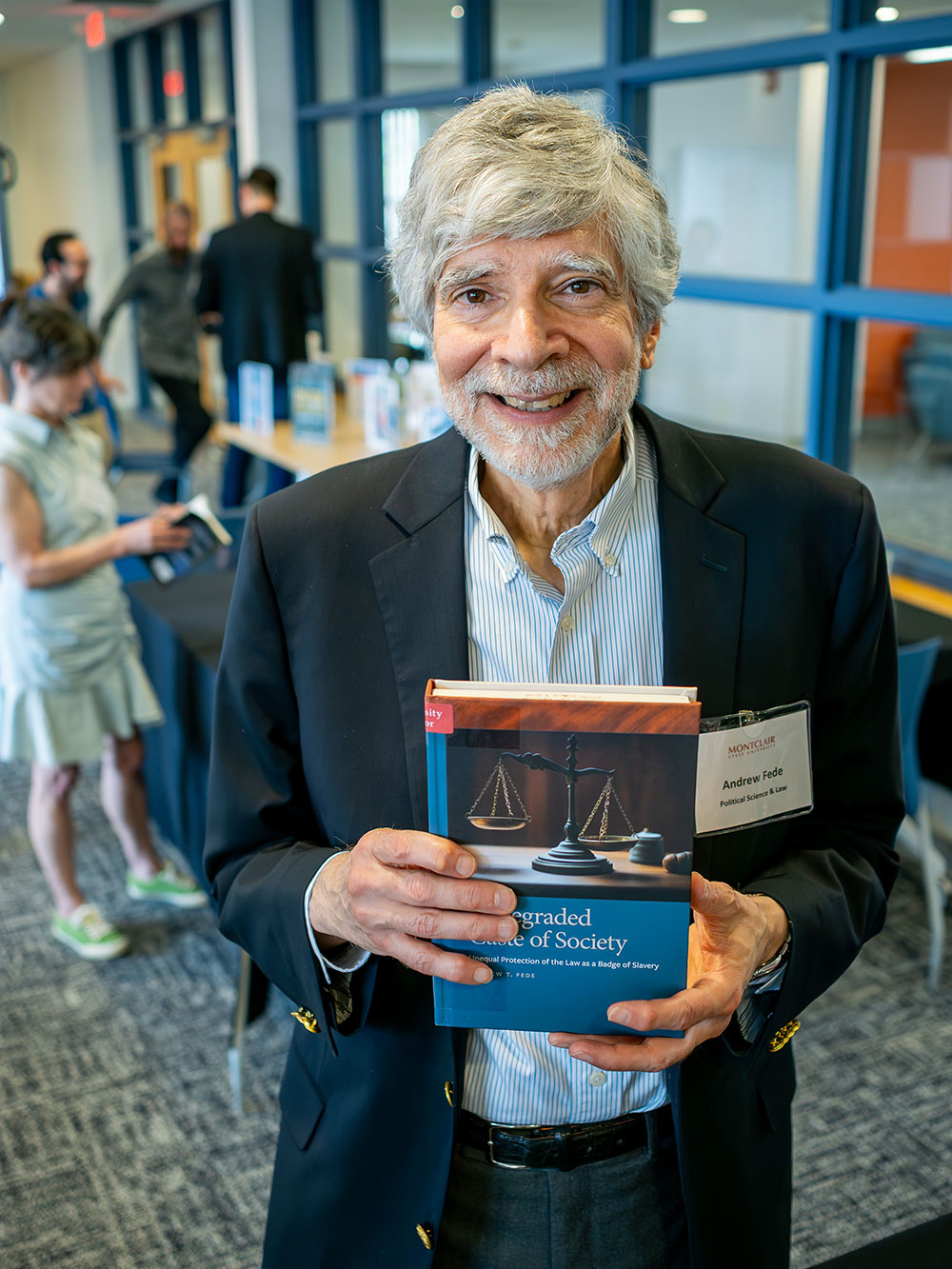 author holding book