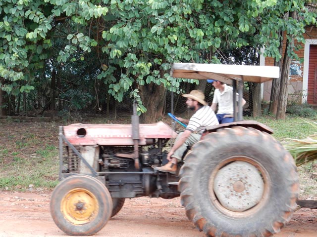 Photo of a man driving a tractor