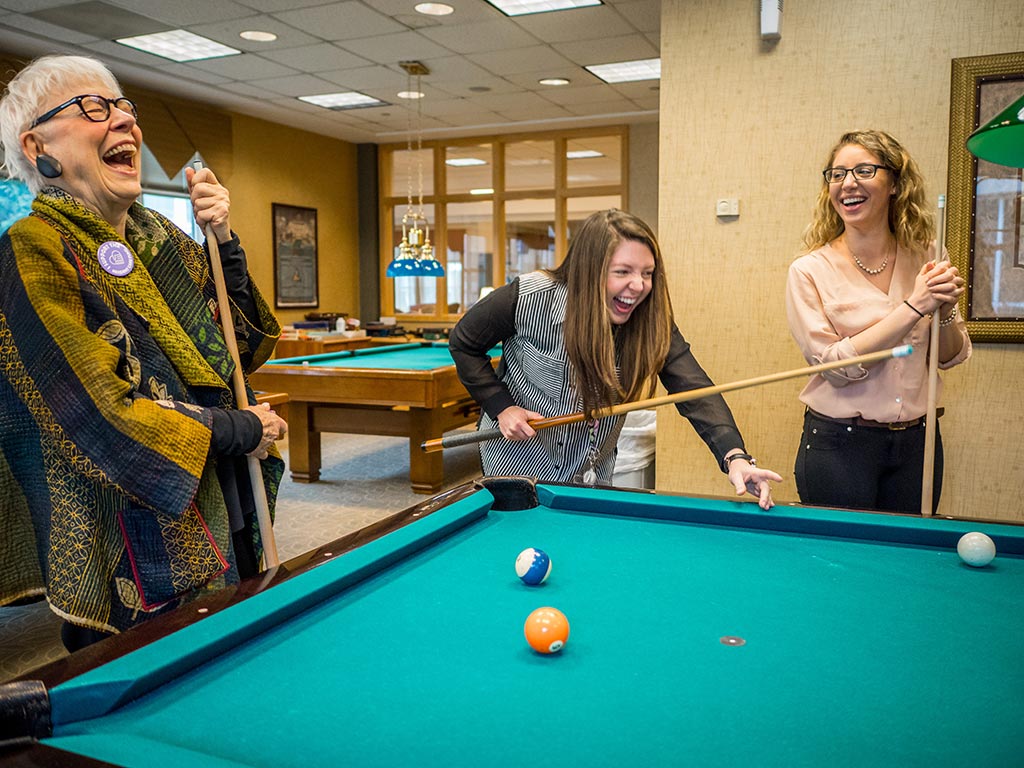 Deborah Greenberg laughs with Cedar Crest employees Kelli Bollen ’12 (center) and Lauren Corrente ’12.