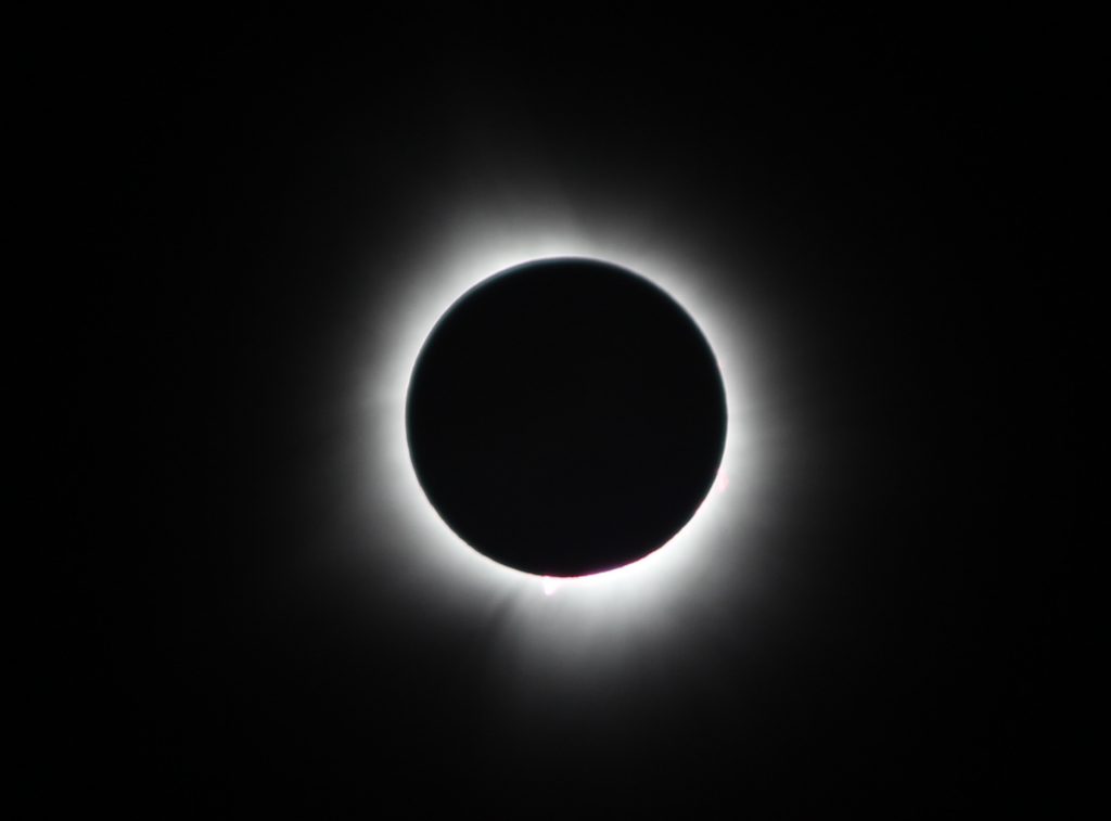Image of the April 8th eclipse taken during totality from Newport, Vermont. Check out the corona and two solar prominences! [Photo by Marc Favata.]