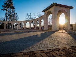 photo of arches on campus with morning light showing through