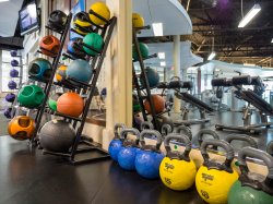 Kettle bells stacked next to a mirror