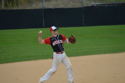 Montclair State University Club Baseball player getting ready to throw to first base