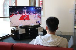 Montclair State University Student Enjoying a game of NBA2K19 in the Equipment Checkout Lounge at the Student Recreation Center Lounge