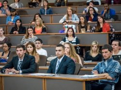 Students attending a session in their business attire.