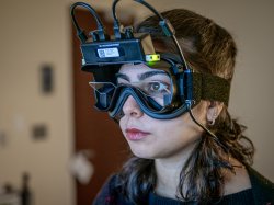 Audiology student Natalie Niyazov wears virtual reality goggles to test her balance using a cutting-edge system acquired by Montclair.