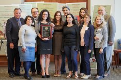 Winner of the 2018 Coccia award surrounded by distinguished guests