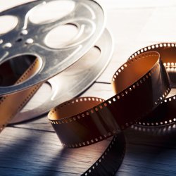 Image of a film reel and a film strip.
