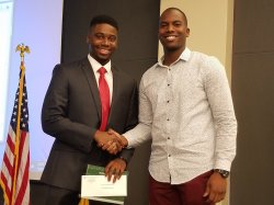 Kishawn Jean-Pierre, left, received the award from the 2016 winner, Stanley Fils