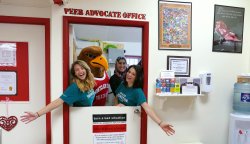 Three students and Rocky inside in the Peer Advocate Office