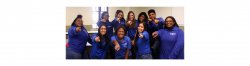 photo of students dressed in the IT service desk blue shirt