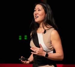 Photo of Dr. Lisa Hanasano speaking at a TEDTalk