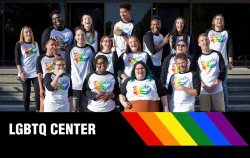 The staff of the LGBTQ Center standing on the steps of the Student Center.