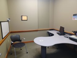 Study room with table, chair, computer and whiteboard