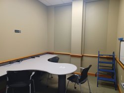 Study room with table, chair, and whiteboard