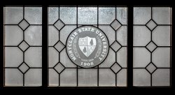 Photo of Montclair State Shield on a decorative window.
