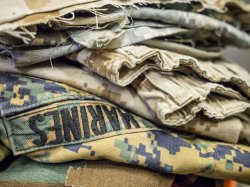 Photo of pile of military uniforms.