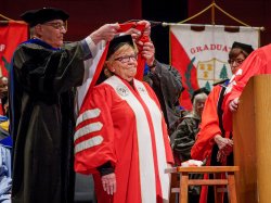 Photo of Senator Loretta Weinberg receiving honorary doctorate from Montclair State University Provost Gingerich at Graduate School Commencement.