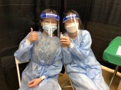 Photo of Jiwon Woo and Danica Arcena volunteering at the Essex County vaccination site.