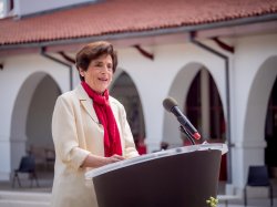 Photo of Montclair State University President Susan A. Cole at a lectern