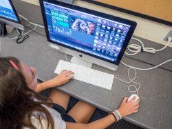 High school student working on computer