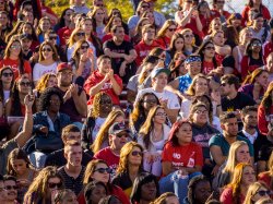 Photo of students in crowd at homecoming football game