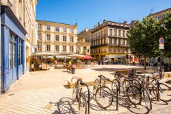 Photo of view on the small square with bicycles in Bordeaux city in France