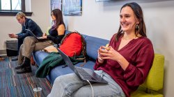 A student sits at a computer on the campus of Montclair State University.