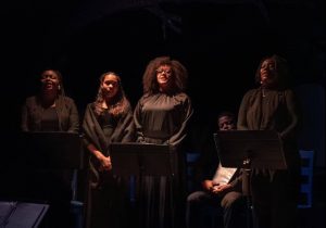 4 people standing on stage