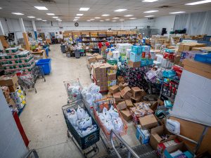 A warehouse full of food awaits unpacking and sorting.

