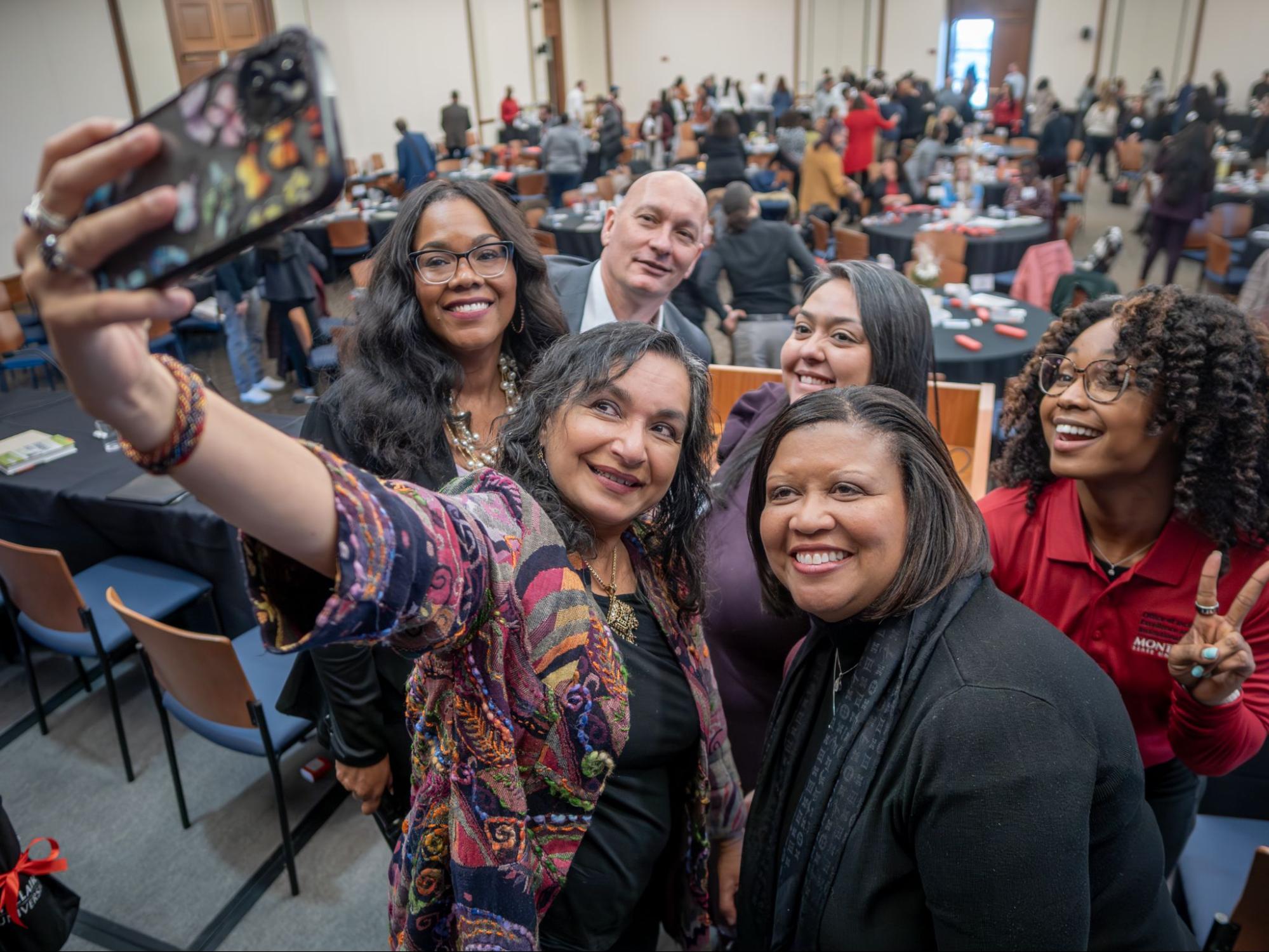 Group of people taking a selfie in Institutional Excellence Summit