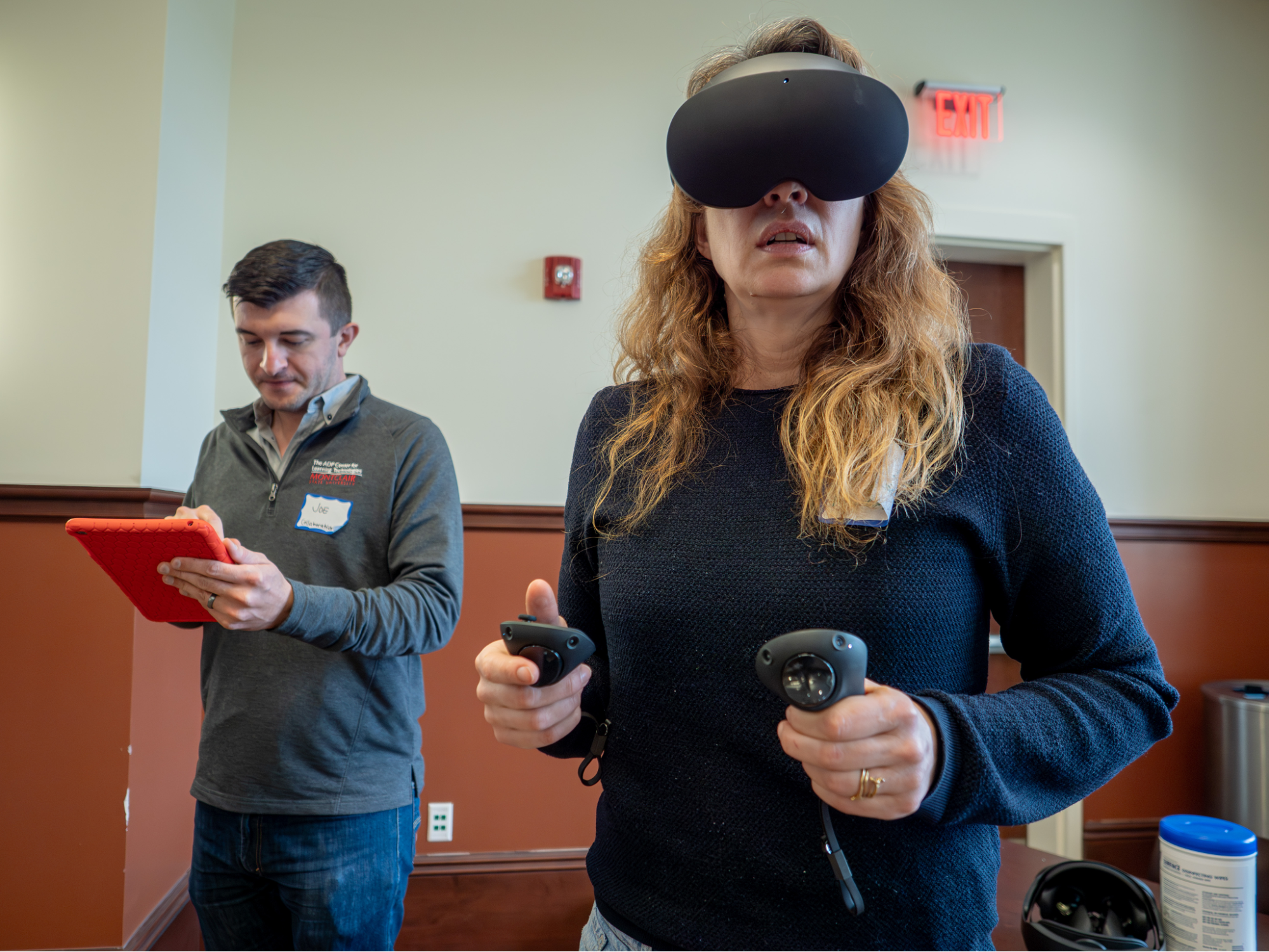 Two people testing out a VR set.