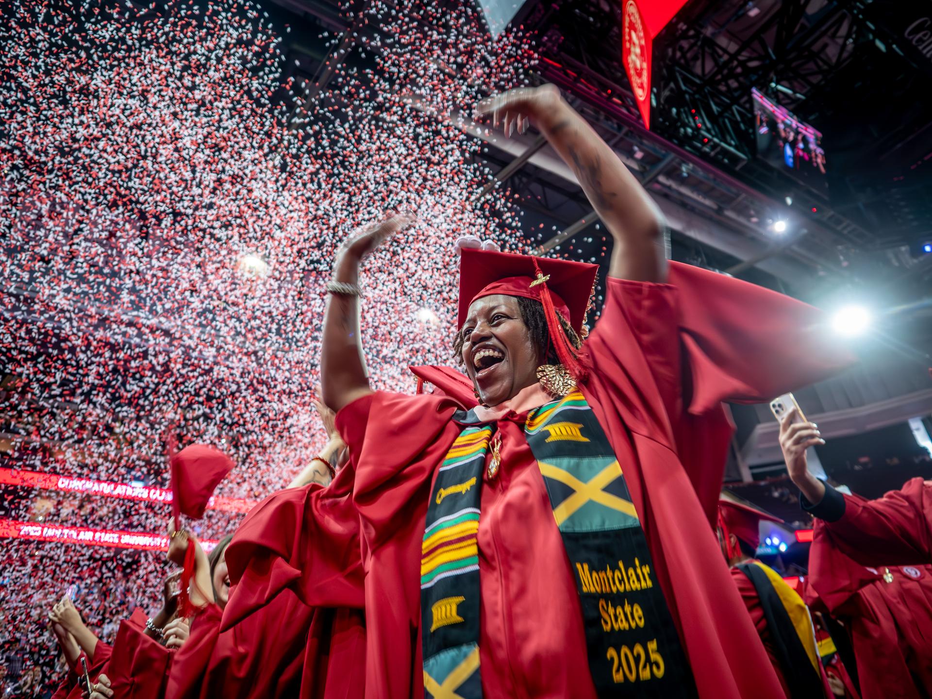 Students celebrating their graduation at commencement.